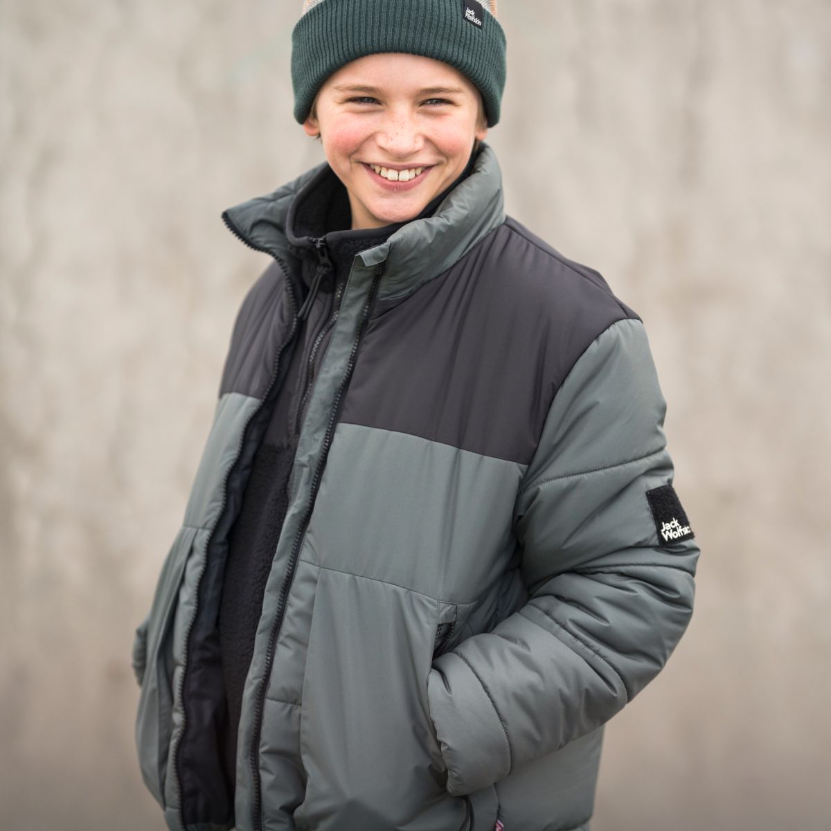 Boy with winter jacket laughing