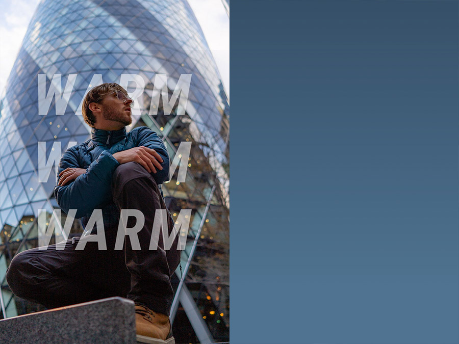 Man poses in front of building